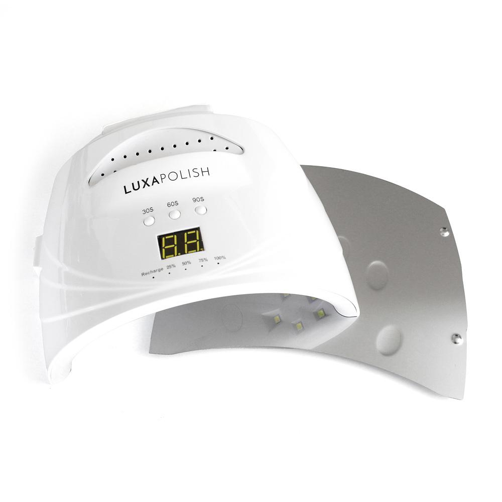 Angled view of LUXAPOLISH LED nail lamp with digital display, 30/60/90s buttons, removable base on white background