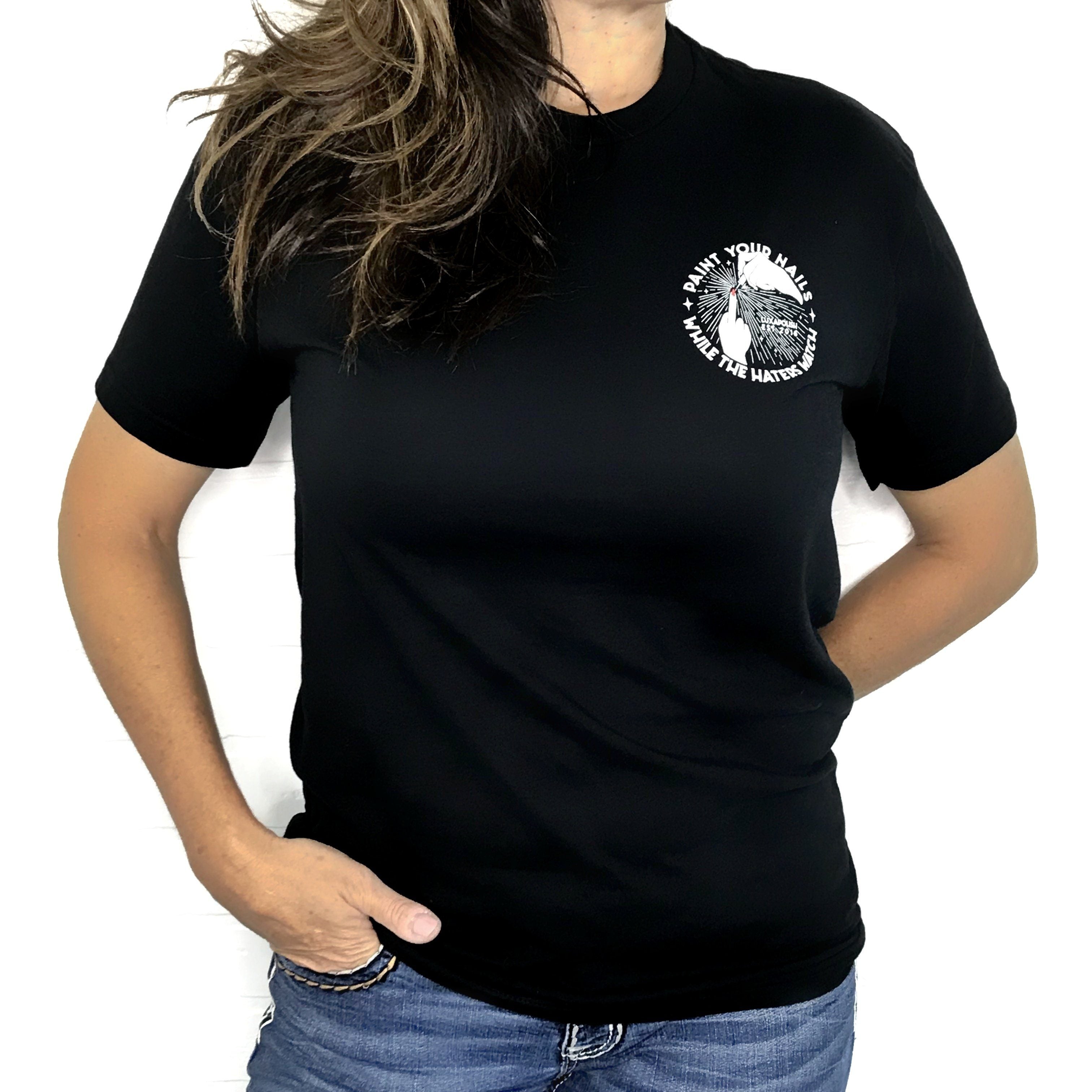 Front view of black HATERS Tee on model, slim fit, with front-left logo reading Paint your nails while the haters watch